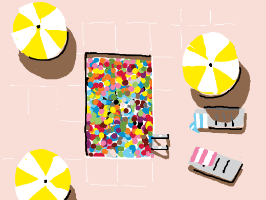 An aerial view of a pool filled with colorful balls.