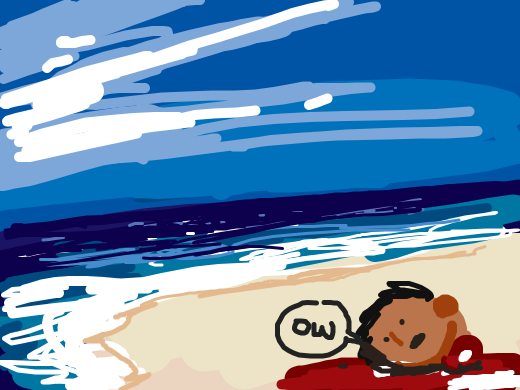 Somebodys severed head on a beach that says &quote;OW&quote;